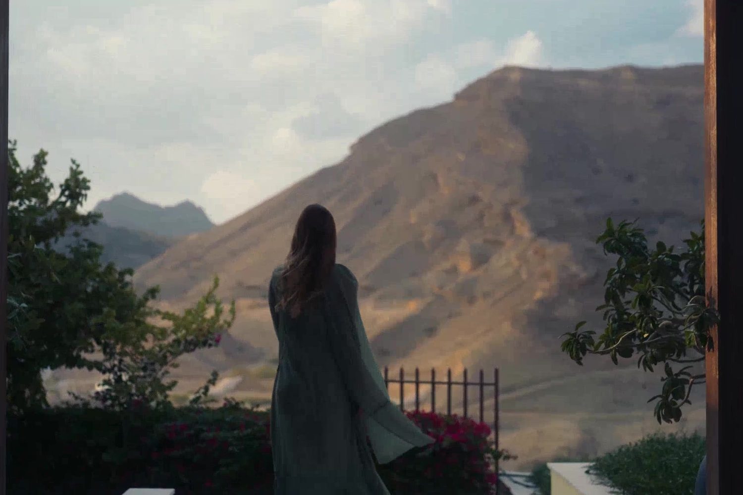 Walk through the gardens with a view of the mountains
